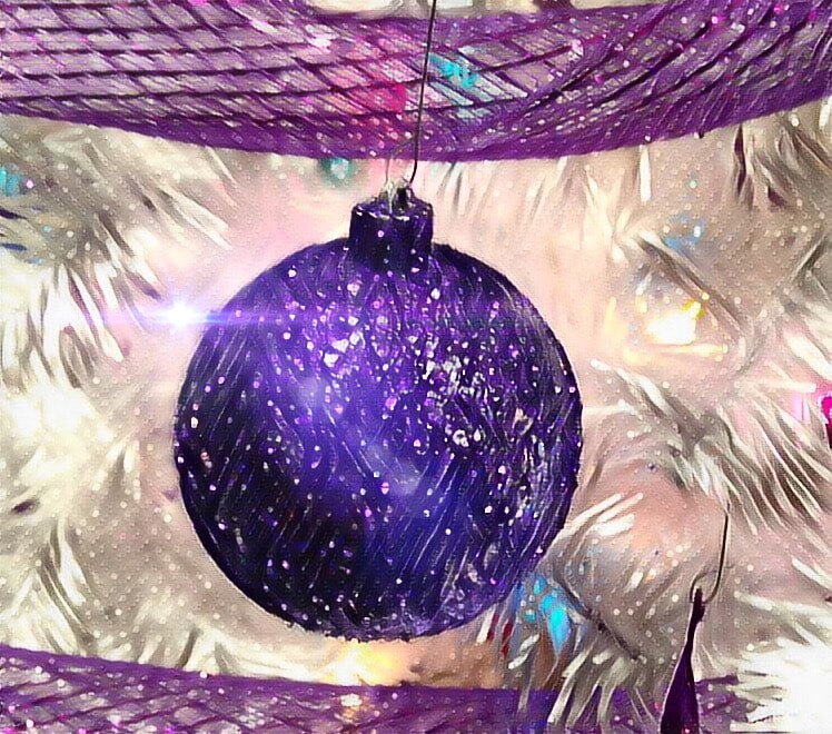 Picture: Image of a glass globe, purple Christmas ornament with glitter.